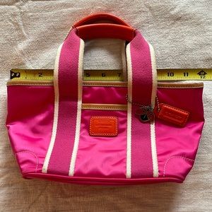 Coach L04K-1893 pink nylon mini bucket tote with leather handles and ladybug tag